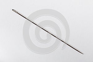 Sewing needle on a white isolated background