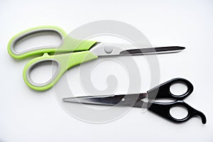 Sewing scissors on a white background. Green scissors