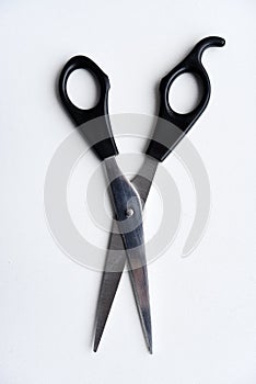 Sewing scissors on a white background. Green scissors