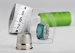 Sewing set from  thimble of colored thread and a centimeter