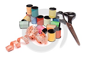 Sewing spools, cantimeter and scissors