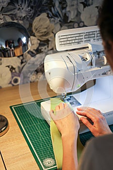 Sewing, stitching and overlocking on a machine at home