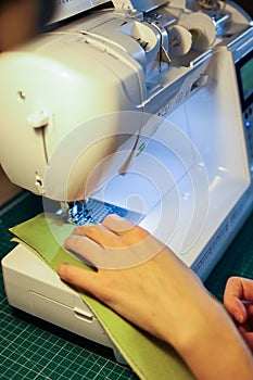 Sewing, stitching and overlocking on a machine at home