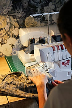 Sewing, stitching and overlocking on a machine at home