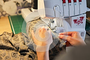 Sewing, stitching and overlocking on a machine at home