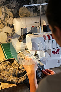 Sewing, stitching and overlocking on a machine at home