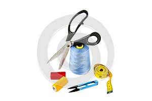 Sewing supplies (thread, scissors and measuring tape) isolated on a white