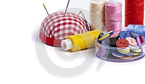 Sewing supplies on a white background close-up, place for text, home crafts and creativity concept, copy space