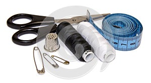 Sewing supplies on white background