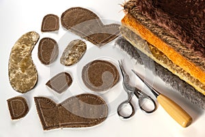 Sewing a teddy bear with your own hands. Hobbies. Fabric, tools and materials for needlework. Selective focus.Copy space