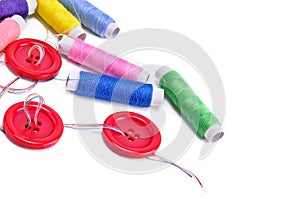 Sewing thread and buttons isolated on white background. Free spa