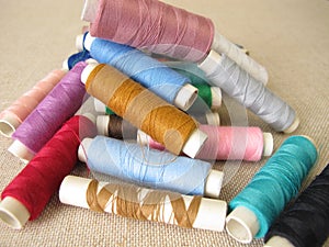 Sewing thread in different colors on farbric