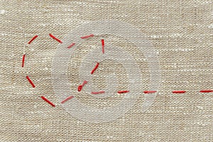 Sewing thread and for knitting, a red string in the form of a medical heart on instruments