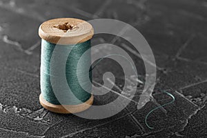 Sewing thread on an old wooden spool