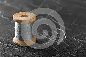 Sewing thread on an old wooden spool