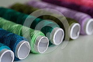 Sewing threads as a multicolored background close up