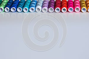 Sewing threads as a multicolored background close up