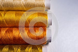 Sewing threads as a multicolored background close up