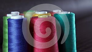 Sewing Threads On Spool. Colorful spools of thread in textile factory.