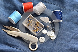Sewing tool on the fabric. Tailor tool set on clothes.