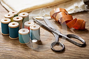 Sewing tools : old scissors, bobbins with thread and needles