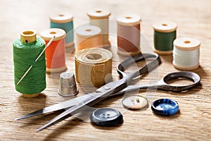 Sewing tools : old scissors, bobbins with thread and needles