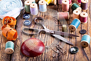 Sewing tools : scissors, bobbins with thread and needles