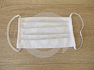 Sewn fabric face mask made of white cotton