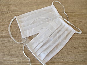 Sewn fabric face mask made of white cotton