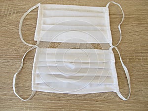 Sewn fabric face mask made of white cotton