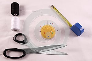 A sewn kit with scissors, wire, tape measure