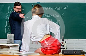 Sex and sexual education. Sexual partners in class. Bearded man point finger at sexual woman. Learning about gender and