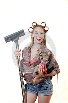 Sexi young blond lady in curlers holding doggy