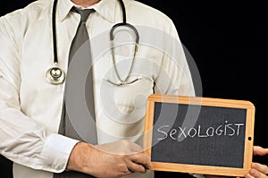 Sexologist written on a school slate photo