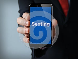 Sexting businessman smartphone photo