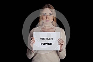 Sexual discrimination problem, voting right, sexism. Young woman holding banner with inscription is woman power