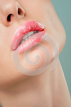 Sexual full lips. Natural gloss of lips and woman& x27;s skin. The mouth is open. Increase in lips, cosmetology.