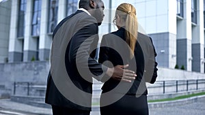 Sexual harassment of business woman at workplace, boss behaves insultingly photo