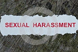 Sexual harassment word on a cut out newspaper photo