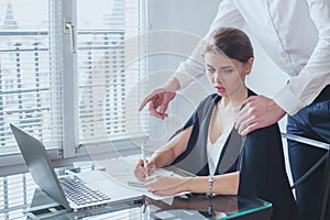 sexual harassment at work, office woman employee and her lustful boss photo