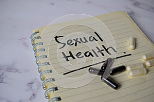 Sexual Health write on a book and keyword isolated on Office Desk. Healthcare/Medical Concept