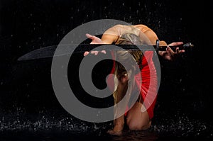 Sexual woman stretches sword