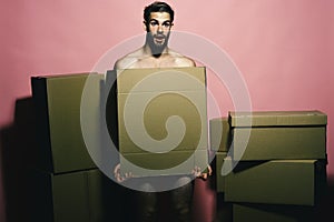 Sexuality and moving concept. Loader with shocked face covers nudity photo