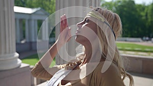 sexy Aphrodite is posing near columns of ancient palace, feminity and image of goddess