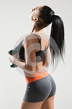 athletic woman with long hair. back