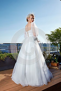 Sexy beautiful blonde woman pretty bride wedding big day marriage ceremony in summer garden wearing long silk and lace white dress