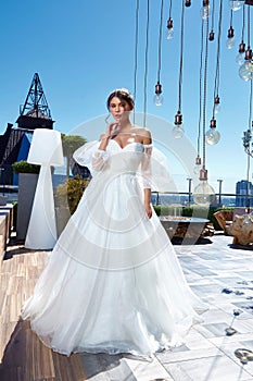 Sexy beautiful brunette woman pretty bride wedding big day marriage ceremony in summer garden wearing long silk and lace white