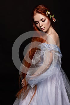 beautiful redhead girl with long hair in dress cotton retro. Woman portrait on black background. Deep eyes. Natural beauty