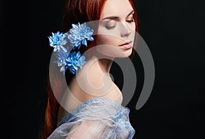 beautiful redhead girl with long hair in dress cotton retro. Woman portrait on black background. Deep eyes. Natural beauty