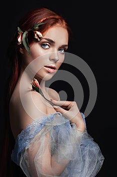 beautiful redhead girl with long hair in dress cotton retro. Woman portrait on black background. Deep eyes. Natural beauty